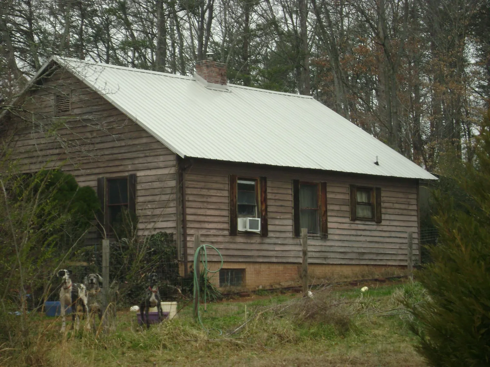 White metal roof on an old wood sided farmhouse in New City